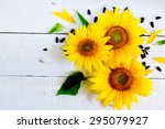Sunflowers On A White Wooden...