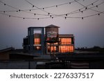 Small photo of Austin, Texas,USA: April 18 2022: Oasis by lake Travis, sunset