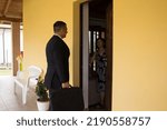 Small photo of Elegant businessman door-to-door salesman talking to a retired woman trying to sell products. Reference to scams and persistent sales people