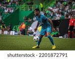 Small photo of Lisbon, Portugal - 09 13 2022: UEFA Champions League game between Sporting CP and Tottenham Hotspur F.C; Cristian Romero during game