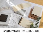 Small photo of Flat lay design of creative interior design moodboard composition with samples materials like wood, textile, stone and black switch on blueprint background
