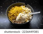 Small photo of Big bowl of unmixed tuna salad with rice, eggs, cucumbers, corn and mayo