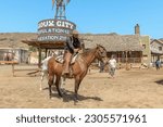 Small photo of Sioux City Park, Gran Canaria - April 2023: The actors of Sioux City Park play the roles of cowboys, sheriffs, bandits, and other characters, and engage visitors in mock gunfights and other activities