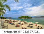 Small photo of Ksamil , Albania - June 9, 2023: People sunbathing on the soft sandy shores of Ksamil Beach, where the sparkling turquoise waters beckon them to venture into the sea and explore the islands.