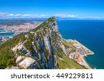 Aerial view of top of Gibraltar Rock, in Upper Rock Natural Reserve: on the left Gibraltar town and bay, La Linea town in Spain at the far end, Mediterranean Sea on the right. United Kingdom, Europe.