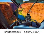 Helicopter cockpit with pilot arm and control console inside the cabin on the Grand Canyon Lake Powell. Reserve on the Colorado River, straddling the border between Utah and Arizona. USA, America.