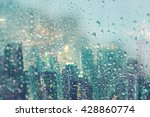 Abstract of water droplets on mirror with city night background in raining day