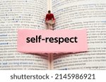 Small photo of self-respect.The word is written on a slip of paper. Emotional nouns, feeling words, emotional phrases. Positive or negative attitudes.