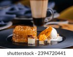 Small photo of Tarta Tine served in dish isolated on table side view of arabic baked dessert food