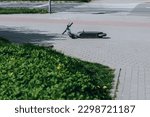 overturned scooter on the sidewalk 