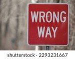 red and white wrong way sign 