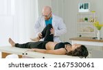 Small photo of The Physical Therapist Evaluates the Condition and Suggests Appropriate Treatment to Relieve the Patient's Pain. Physiotherapy Treatment in the Modern Rehabilitation Clinic