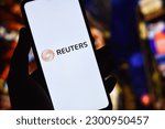 Small photo of Reuters logo on a smartphone screen. It is a global news agency that provides news and information to businesses, governments, and media organizations around the world: Dhaka, Bangladesh- May 5, 2023