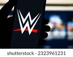 Small photo of WWE (World Wrestling Entertainment) logo stock image. It is an American integrated media and entertainment company that primarily deals with professional wrestling: Dhaka, Bangladesh- June 27, 2023