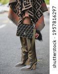 Small photo of Milan, Italy - September 20, 2018: Fashionable woman wearing Fendi outfit and handbag on the streets of Milan, detail.