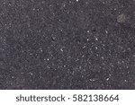 Asphalt surface close up texture. Bitumen surface background. Asphalt with chewing gum. Tarmac rim wallpaper picture. Tarmac skin backdrop. Pitch pattern photography. Blacktop texture home screen.