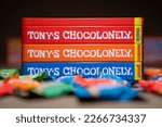 Small photo of Amsterdam, Netherlands - February 25, 2023: Metal Box of Tony's Chocolonely and Tiny Tony's Packages