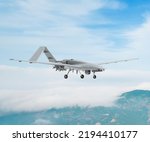Bayraktar TB2 Unmanned aerial vehicle gliding through the clouds. Bayraktar TB2 combat drone in flight over the clouds.