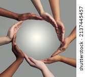 Small photo of Coming together to form one. Cropped shot of a group of hands linking together to form a circle against a grey background.