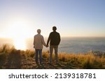Facing life together. View of a senior couple standing on a hillside together.
