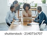 Small photo of Those who fail to plan, plan to fail. Shot of a group of professionals using wireless technology during a meeting.