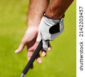 Small photo of The proper grip is important. Cropped image of a golfer demonstrating the proper grip.