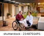 Small photo of He trusts her expertise implicitly. Shot of a young doctor and her elderly patient talking while sitting outside.