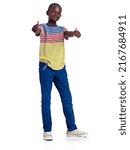 Small photo of Its a definite Yes. Full length studio shot of an african teenage boy giving a double thumbs up in front of a white background.