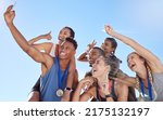 Small photo of Group of diverse olympic athletes taking a selfie while having fun and showing hand gestures. Happy and cheerful runners taking a photo together. Young male sprinter taking a picture with athletes