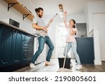 Small photo of Having fun doing chores, dancing and singing father and daughter cleaning the living room together at home. Carefree, happy and cheerful parent bonding, doing housework and playing with little girl