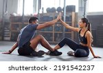 Small photo of Motivation, celebrate and support with fitness coach doing high five with woman in the gym. Active and fit woman training or practicing strength and stamina workout with her friend in a health