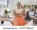 Innovation, leadership and a proud black business woman standing in power in a corporate office. Happy African American leader excited by successful goal management with diverse female employees