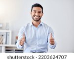 Small photo of Thumbs up, work success and business man in support of startup company, management thank you in office and happy with corporate goal. Portrait of Asian worker with agreement hand sign for career