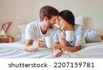 Small photo of Love, happy and a couple with coffee in bed on beautiful morning at home. Weekend, wake up and smile, woman and man relax with hot drink in bedroom. Romance, happiness and drinking sweet tea together