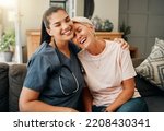 Senior woman, hug or medical caregiver in house living room in comfort trust, support or security bond. Smile, happy or laughing nursing home retirement elderly and healthcare Brazilian nurse or help