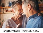Small photo of Dancing, happy senior couple smile together and dance with love in retirement. Anniversary celebration at home, mature married healthy man and active woman support each other in retired old age