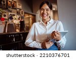 Restaurant, smile and tablet with woman of small business for digital, management and service. Cafe, success and store with portrait of employee working on vision, waiter and coffee shop startup