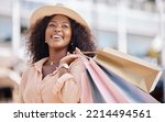 Small photo of Shopping bag, happy black woman and travel customer smile for discount sales, thinking of luxury fashion choice and market in summer. Wealthy, rich and smile consumer on vacation in Ibiza Spain city