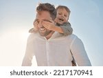 Small photo of Happy family, father and child hands covering dads eyes at a beach in summer, playing and having fun with surprise, guess and game. Family, hand and kid closing father eye while walking on vacation