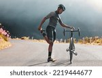Small photo of Black man, road and bicycle stretching, fitness or marathon training exercise, triathlon sports and outdoor cycling workout. Mountain bike athlete warm up body, cardio performance and balance focus