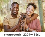 Small photo of Love, portrait and black couple with dog at animal shelter for adoption at kennel. Support, care or happy interracial couple, man and woman bonding with foster puppy or pet and enjoying time together