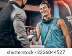 Small photo of Men, credit card machine or payment in gym membership, personal trainer access or fitness coaching subscription. Banking device, nfc or cashless transaction or happy, smile or training sports athlete