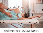 Small photo of Spa, wellness and physiotherapy, massage and muscle relax with woman and physiotherapist for health and physio. Body care, chiropractor and back massage at clinic with healthy physical therapy.