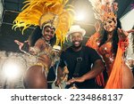 Small photo of Carnival, brazil and band with woman dancers outdoor together for a new year celebration in rio de janeiro. Portrait, party and event with a man and female performance artists celebrating tradition