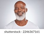 Small photo of Senior black man, face and self care with skincare, dermatology and cosmetics for clean, glow and fresh skin. Headshot of African male with a beard on grey studio background for beauty spa treatment