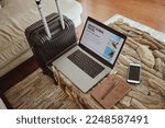 Laptop screen, travel website and suitcase background for vacation planning, hospitality marketing and hotel online blog advertising. Ux or ui web design, luggage and technology for contact us or faq