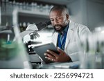 Small photo of Black man thinking, science and tablet for online research, laboratory and healthcare sample. African American male, scientist or research in lab, digital data and update experiment results and focus