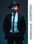 Small photo of Man portrait, suit or fashion on studio background in secret spy, dark isolated mafia or crime lord aesthetic. Model, gangster or serious bodyguard in stylish, trendy or tuxedo clothes in leadership