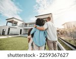 Love, new home and family standing in their backyard looking at their property or luxury real estate. Embrace, mortgage and parents with their children on grass at their house or mansion in Canada.