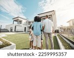 Small photo of Love, new house and family in their backyard together looking at their property or luxury real estate. Embrace, mortgage and parents with their children on grass at their home or mansion in Canada.